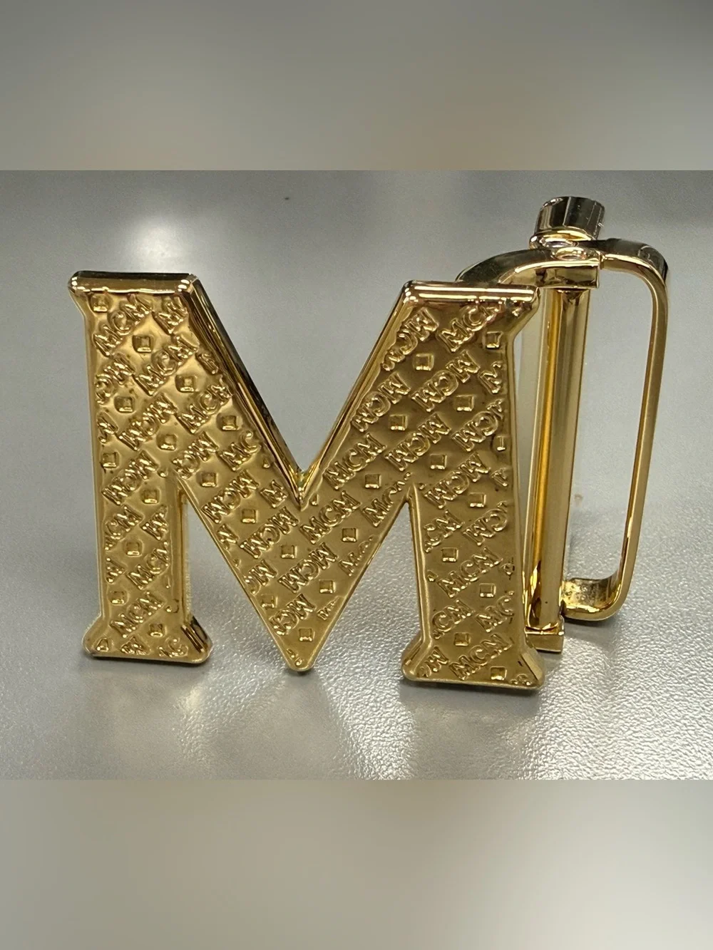 MCM Gold Tone Initial “M” Automatic Ratchet Belt Buckle Designer Logo